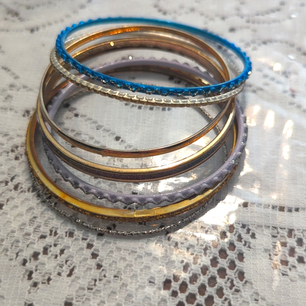 Bundle of 7 bangle bracelets different colors